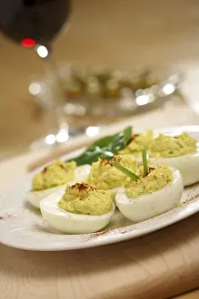 Empty Table Setting Photos Drucke: Deviled eggs and appetizers on a decorative white plate