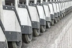 Airport Terminal Interior Drucke: A diagonal row of carts in the hall