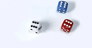 Leisure Activity Image Drucke: Dice rolling against White background