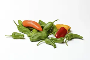Bright Food Photography Drucke: Different coloured peppers on a light background