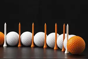 Deserted Golf Scene Drucke: Different golf balls on the black table