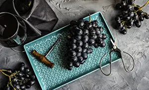 Wine Grape Photography Drucke: Different grapes and red wine on rustic background with copy space