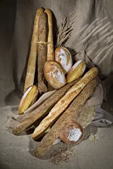 Wholemeal Bread Arrangement Drucke: Different kinds of bread and pastry on a canvas studio background