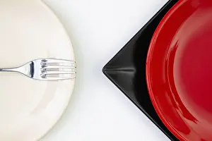 Flat Lay Photography Drucke: Different red, black and plates on the white table