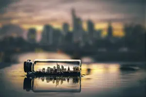 Deserted Cityscape Europe Drucke: Digital Composing, skyline at sunset in a message in a bottle