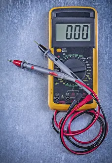 Power Supply Equipment Drucke: Digital electrical tester Current probe on metallic background