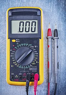 Single Object Studio Photography Drucke: Digital electrical tester on metallic surface top view