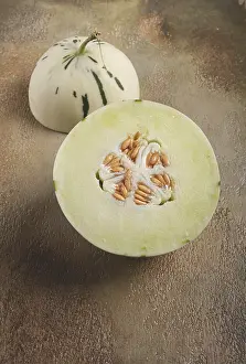 Exotic Tropical Fruit Images Drucke: Dino melon, cut, on the table, top view