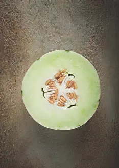 Ecological Food Photography Drucke: Dino melon, cut, on the table, top view