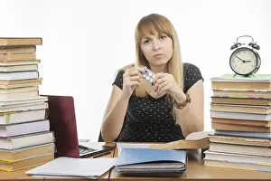 Healthcare System Failure Drucke: Diseased student sitting at the table with tablets in hands