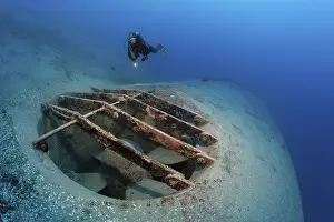 Red Sea Egypt Drucke: Diver looking at bow thrusters on shipwreck