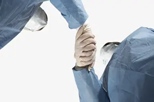 Medical Care Professionals Drucke: Two doctors linking hands