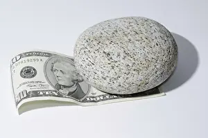 White Background Currency Drucke: The Bill of Ten Dollar Lying Under a Stone with White Background