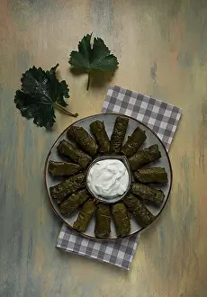 Western Asian Dishes Drucke: Dolma, cabbage rolls in grape leaves
