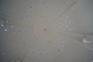 Kallithea Thermal Baths Drucke: Dome-shaped ceiling with star-shaped light patterns in shades of blue inside a structure