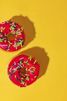 Food Photography Pastry Drucke: Donuts on yellow background with red icing