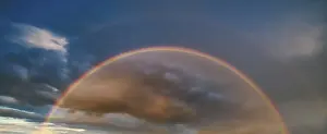 Deserted Evening Landscape Drucke: Double rainbow in atmospheric sky with thunderclouds at sunset