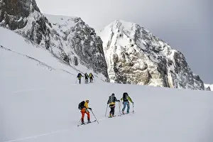 Snowy Mountain Range Europe Drucke: Dramatic atmosphere, Ski tourers