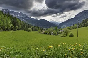 Cloudy Day In The Alps Drucke: Dramatic clouds over the alpine landscape
