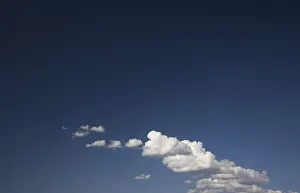 Atmospheric Landscapes Drucke: Dramatic clouds on a deep blue sky