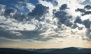 Cloud Formations Europe Drucke: Dramatic clouds and silhouette of hills