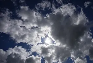 Cloudy Atmosphere Drucke: Dramatic cloudscape with (cumulus) clouds and sunrays