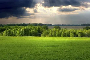 Cloudscape Photography Drucke: Dramatic cloudscape over village landscape