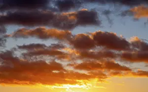 Atmospheric Evening Light Europe Drucke: Dramatic evening sky with clouds at sunset