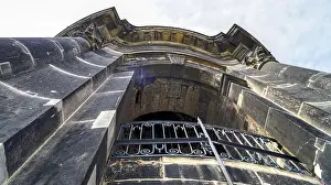 German Federal Republic Buildings Drucke: Dramatic perspective of a stone gothic structure with iron balcony under cloudy sky
