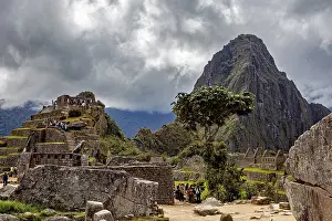 Inca Ruins South America Drucke: Dramatic sky over ancient ruins in front of a big mountain
