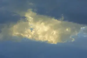 European Cloudy Skies Drucke: Dramatic sky with bright clouds in the sunlight shining through a gap