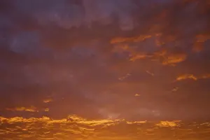 Sunrise Germany Drucke: Dramatic sky with orange-red clouds at sunrise
