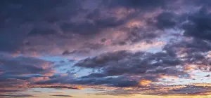 Cloudy Panoramic View Drucke: Dramatic storm clouds in the morning light