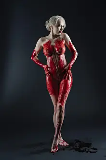 Blood Body Art Drucke: In a dramatic studio setting, a woman strikes a confident pose