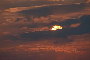 Evening Atmosphere In Nature Reserve Drucke: Dramatic sunset with clouds and sun