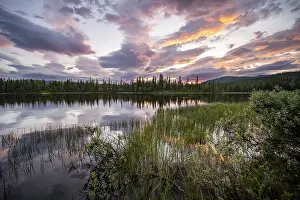 Deserted Waterfront Norway Drucke: Dramatic sunset by the river Namsen with reflection