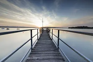 Evening Sun German Landscape Drucke: A dramatic sunset seen from a pier