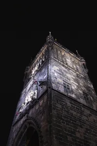 Historic Cityscape Of Prague Drucke: A dramatic view of a Gothic tower in Prague