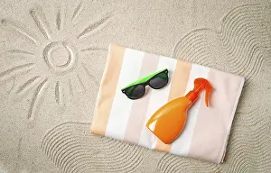 Deserted Coastline Photo Drucke: Drawing on the sand, sun and waves