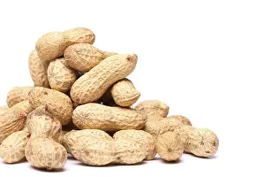 Bright Studio Shot Drucke: Dried peanuts in closeup on a white background