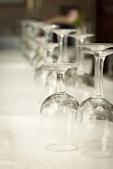 Deserted Dining Table Drucke: Several drinking glasses abstract in formal dining room setting