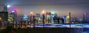 Frankfurt Skyline At Night Drucke: Driving train in front of the skyline in the evening