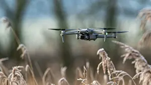 Unmanned Aerial Vehicle Technology Drucke: Drone in flight over marshland