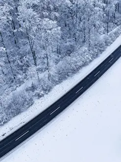 Baden Wurttemberg Aerial Photo Drucke: Drone image of a road surrounded by snow in a wintry environment