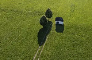 Drone Photography Austria Drucke: Drone image, Small field chapel between two deciduous trees