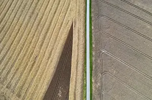 Upper Austria Agricultural Landscape Drucke: Drone shot, road through harvested fields with abstract patterns