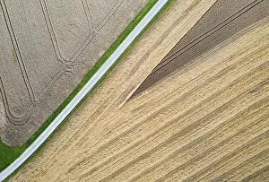 Upper Austria Agricultural Landscape Drucke: Drone shot, road through harvested fields with abstract patterns