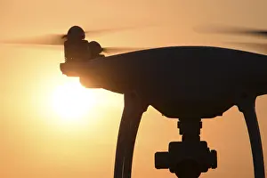 Evening Atmosphere Drucke: Drone silhouette against the background of the sunset