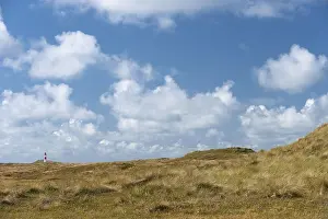 North Sea Island Drucke: Dune landscape and lighthouse with blue sky at Ellenbogen