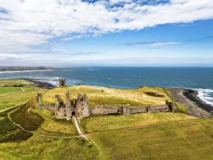 Historic British Fortification UK Drucke: Dunstanburgh Castle from a drone